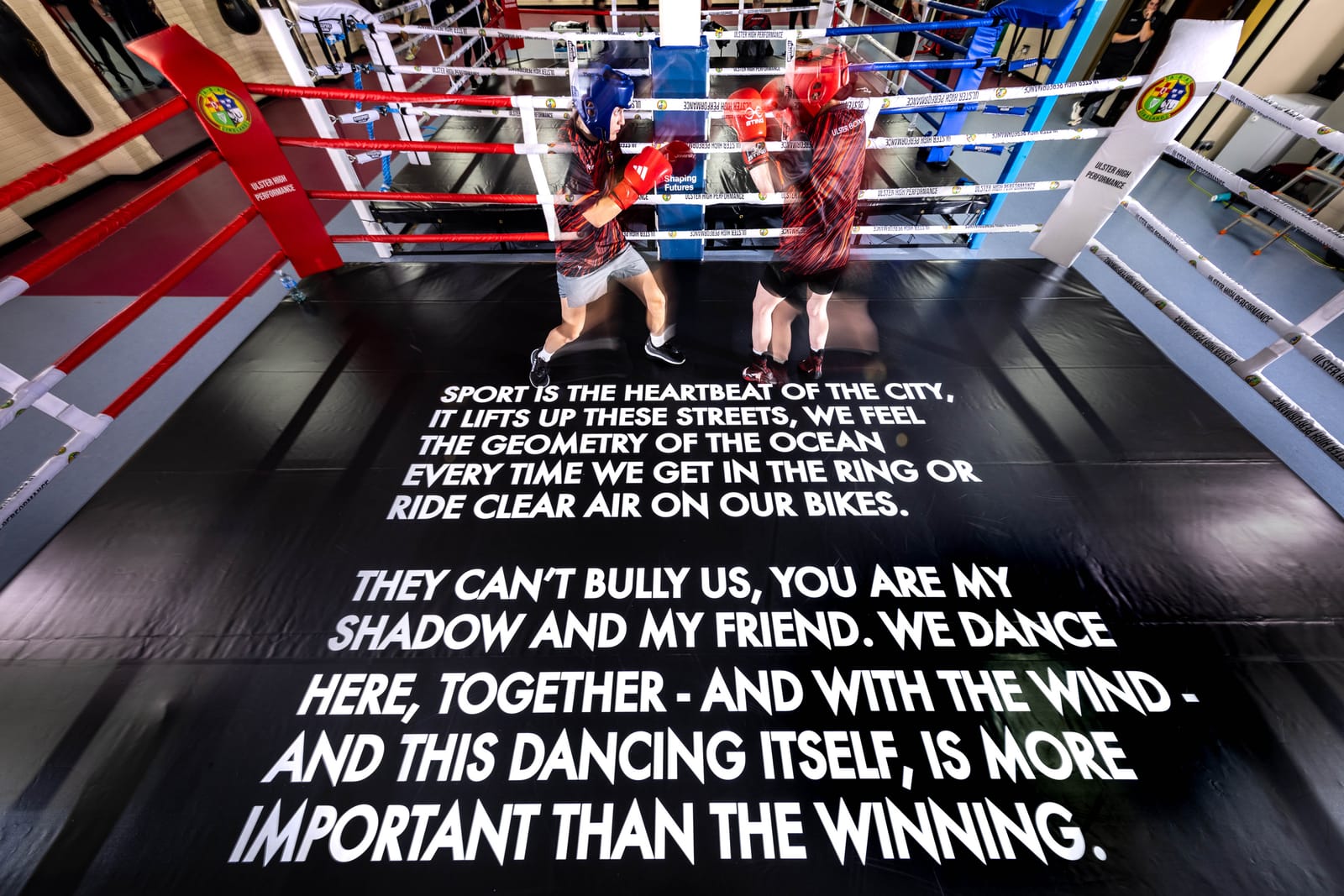 Robert Montgomery's poem It's Not About Winning installed across the boxing-ring canvas at the Ulster Boxing High Performance Centre in Belfast
